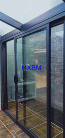 As portas deslizantes de dobramento internas da cor cinzenta, dobram as portas de alumínio vitrificadas duráveis